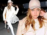 New York, NY - Gigi Hadid returns to her NYC apartment. The 20-year-old model is wearing an all white monochrome look. Gigi is on board with the baseball cap trend matching it with her outfit. \n  \nAKM-GSI        April 6, 2016\nTo License These Photos, Please Contact :\nSteve Ginsburg\n(310) 505-8447\n(323) 423-9397\nsteve@akmgsi.com\nsales@akmgsi.com\nor\nMaria Buda\n(917) 242-1505\nmbuda@akmgsi.com\nginsburgspalyinc@gmail.com