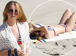 06 April 2016 - Malibu, CA - USA
**STRICTLY AVAILABLE FOR UK AND GERMANY USE ONLY**
*EXCLUSIVE ALL ROUND PICTURES* 
Singer Lana Del Rey, 30, stripped off while soaking up the sun on a Malibu beach wearing a two-piece striped bikini.
BYLINE MUST READ : AKM-GSI-XPOSURE
***UK CLIENTS - PICTURES CONTAINING CHILDREN PLEASE PIXELATE FACE PRIOR TO PUBLICATION ***
*UK CLIENTS MUST CALL PRIOR TO TV OR ONLINE USAGE PLEASE TELEPHONE 0208 344 2007*
