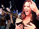 BURBANK, CALIFORNIA - APRIL 09:  Actress Melissa McCarthy crowd surfs her way to accept the Comedic Genius Award during the 2016 MTV Movie Awards at Warner Bros. Studios on April 9, 2016 in Burbank, California.  MTV Movie Awards airs April 10, 2016 at 8pm ET/PT.  (Photo by Kevin Mazur/WireImage for MTV)