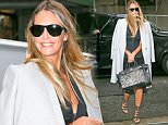 EXCLUSIVE: Elle Macpherson spotted carrying her Hermes Zebra handbag while out in a rainy day in New York City, the model was a grey coat over  her shoulders ....Pictured: Elle Macpherson..Ref: SPL1262406  120416   EXCLUSIVE..Picture by: Felipe Ramales / Splash News....Splash News and Pictures..Los Angeles: 310-821-2666..New York: 212-619-2666..London: 870-934-2666..photodesk@splashnews.com..