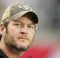 FILE - In this Dec. 27, 2015 file photo, singer Blake Shelton watches from the sidelines prior to an NFL football game between the Green Bay Packers and the ...