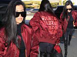 Please contact X17 before any use of these exclusive photos - x17@x17agency.com   Kourtney Kardashian heads out of Los Angeles via an early flight on Saturday morning. The single mother-of-three travels alone but keeps up family allegiances by wearing a jacket promoting brother-in-law Kanye West's Pablo project. Saturday, April 16, 2016 X17online.com PREMIUM EXCLUSIVE