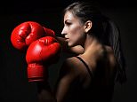 beautiful woman with the red boxing gloves,black background; Shutterstock ID 154444928