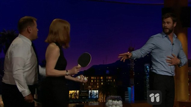 Having a blast! Chris Hemsworth allowed James Corden to fire ping pong balls off his back as he appeared on his Late Late show with Jessica Chastain and other Huntsman co-stars on Thursday 
