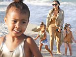 Exclusive... 52031858 'Keeping Up With The Kardashians' sisters Kim Kardashian and Kourtney Kardashian head to the beach with their two daughters in Miami, Florida on April 22, 2016. .  Penelope Disick's sunglasses matched her mom.  North appeared to enjoy most of her time, but got a little unhappy and needed to hug her mom for comfort.  The group walked by the shoreline, and had a great time with each other. ***NO WEB USE W/O PRIOR AGREEMENT - CALL FOR PRICING*** FameFlynet, Inc - Beverly Hills, CA, USA - +1 (310) 505-9876