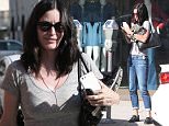 Beverly Hills, CA - Actress, Courtney Cox, pulls a juggling act as she feeds a meter while trying to hold on to her cell phone, car keys, and a pair of sneakers.\nAKM-GSI        April  25, 2016\nTo License These Photos, Please Contact :\nSteve Ginsburg\n(310) 505-8447\n(323) 423-9397\nsteve@akmgsi.com\nsales@akmgsi.com\nor\nMaria Buda\n(917) 242-1505\nmbuda@akmgsi.com\nginsburgspalyinc@gmail.com