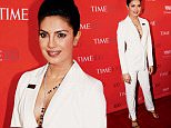 Actress Priyanka Chopra poses for photographers on the red carpet as she arrives for the TIME 100 Gala in Manhattan, New York, April 26, 2016. REUTERS/Shannon Stapleton