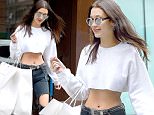 EXCLUSIVE: Bella Hadid seen wearing a white belly shirt and carrying Givenchy bags in New York City.\n\nPictured: Bella Hadid \nRef: SPL1273449  010516   EXCLUSIVE\nPicture by: Frank Sullivan/Splash News\n\nSplash News and Pictures\nLos Angeles: 310-821-2666\nNew York: 212-619-2666\nLondon: 870-934-2666\nphotodesk@splashnews.com\n