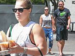 Exclusive... 52043803 MMA fighter Ronda Rousey and her boyfriend Travis Browne were spotted after the gym grabbing lunch with their friend in Los Angeles, California on May 3, 2016.  Ronda had coffee in her hands, while Travis carried his gym bag. FameFlynet, Inc - Beverly Hills, CA, USA - +1 (310) 505-9876