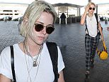 Los Angeles, CA - Kristen Stewart shows off her blonde hairdo while getting ready to catch a departing flight out of LAX. The newly single actress wore a simple white tee with leather suspenders, plaid colored pants and Adidas black sneakers.\nAKM-GSI      May 8, 2016\nTo License These Photos, Please Contact :\nSteve Ginsburg\n(310) 505-8447\n(323) 423-9397\nsteve@akmgsi.com\nsales@akmgsi.com\nor\nMaria Buda\n(917) 242-1505\nmbuda@akmgsi.com\nginsburgspalyinc@gmail.com