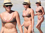 151619, EXCLUSIVE: 'Arrow' star Katie Cassidy shows off her bikini body on the beach in Miami. Katie showed off her flat stomach in a multicolored bikini as she took a dip in the ocean with a friend. Miami, Florida - Sunday May 08, 2016. Photograph: Brett Kaffee/Thibault Monnier, ¬© Pacific Coast News. Los Angeles Office: +1 310.822.0419 sales@pacificcoastnews.com FEE MUST BE AGREED PRIOR TO USAGE