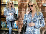 Picture Shows: Nicky Hilton  May 11, 2016\n \n Pregnant socialite, Nicky Hilton, is spotted gently caressing her growing baby bump while taking a stroll in New York City, New York. She looked peacefully happy in her chic printed top, jeans, flats and sunglasses. \n \n Non Exclusive\n UK RIGHTS ONLY\n \n Pictures by : FameFlynet UK © 2016\n Tel : +44 (0)20 3551 5049\n Email : info@fameflynet.uk.com