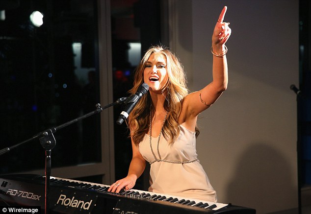 Stronger today: Delta Goodrem said 13 years after launching her hit debut album  she is a stronger person who knows what she is worth, and what she will and won¿t put up with