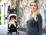 **EXCLUSIVE**  Date: May 15th 2016  Photo Credit: MOVI Inc.\nHolly Madison looks happy and healthy displaying her growing baby bump on a morning walk with her daughter Rainbow in Los Angeles,CA.