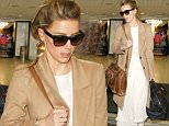 Actress Amber Heard looks chic in a tan coat and a white dress in brown sandals as she arrives at LAX airport in Los Angeles, CA\n\nPictured:  Amber Heard \nRef: SPL1285827  180516  \nPicture by: iPix211/London Ent/Splash News\n\nSplash News and Pictures\nLos Angeles: 310-821-2666\nNew York: 212-619-2666\nLondon: 870-934-2666\nphotodesk@splashnews.com\n