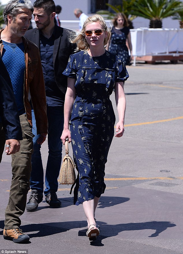 Feminine and flirty: The Fargo actress looked the picture of elegance in a navy tea dress as she joined the likes of Vanessa Paradis and Donald Sutherland at the Palace Festival
