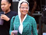 EXCLUSIVE: Christina Milian grabs a smoothie after Soul Cycle class in Los Angeles, California. The pop princess visited Earth Bar to pick up a purple beverage after her workout. Wearing all green gym clothes, white trainers and clear rimmed glasses, the star covered her hair with a headscarf. Yesterday she was seen arriving at LAX airport with a new short hairdo, but kept the new look under wraps today. 

Pictured: Christina Milian
Ref: SPL1286112  190516   EXCLUSIVE
Picture by: Splash News

Splash News and Pictures
Los Angeles: 310-821-2666
New York: 212-619-2666
London: 870-934-2666
photodesk@splashnews.com