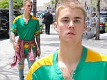Beverly Hills, CA - Justin Bieber emerges from a blacked out limo SUV in a baggy T-shirt and distressed jeans for a sushi lunch at Sugarfish in Beverly Hills.\nAKM-GSI    May  20, 2016\nTo License These Photos, Please Contact :\nSteve Ginsburg\n(310) 505-8447\n(323) 423-9397\nsteve@akmgsi.com\nsales@akmgsi.com\nor\nMaria Buda\n(917) 242-1505\nmbuda@akmgsi.com\nginsburgspalyinc@gmail.com