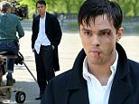 Actor Nicholas Hoult, sporting bruises and a black eye, films 'The Rebel in the Rye' in Central Park in New York City on May 19, 2016. Nicholas chats with director Danny Strong between takes. Nicholas films a scene where he comes upon a group of Transcendentalists meditating. \n\nPictured: Nicholas Hoult\nRef: SPL1286615  190516  \nPicture by: Christopher Peterson/Splash News\n\nSplash News and Pictures\nLos Angeles: 310-821-2666\nNew York: 212-619-2666\nLondon: 870-934-2666\nphotodesk@splashnews.com\n