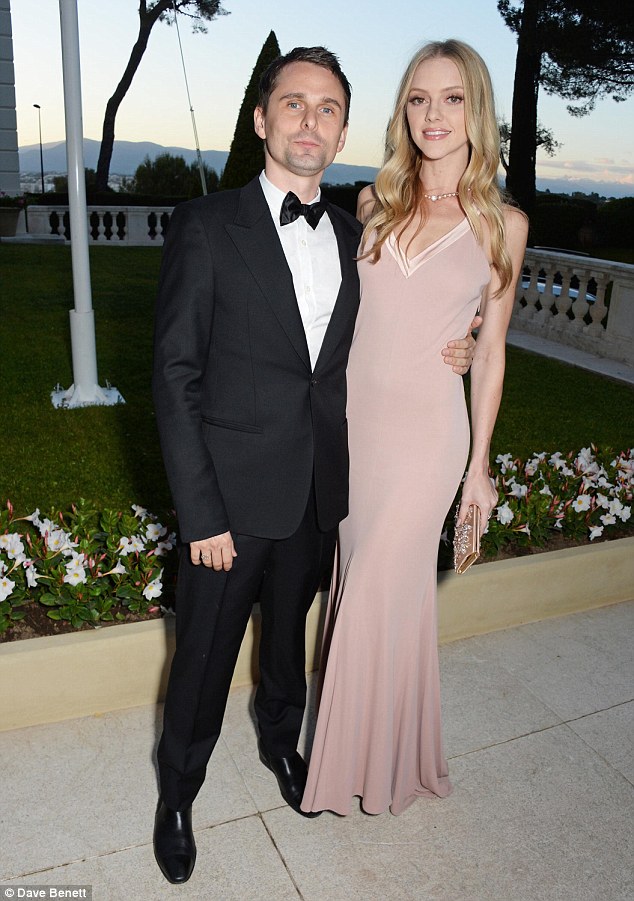 Handsome pair: The 26-year-old blonde beauty slipped into a stunning dusky pink gown while her Muse frontman beau, 37, looked dashing in a tuxedo