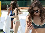 EXCLUSIVE TO INF.\nMay 20, 2016:  Singer and actress Hailee Steinfeld arrives to Miami International Airport in a white dress and then hits her hotel pool in a cute bikini for some lunch.\nMandatory Credit: INFphoto.com Ref: infusmi-20/21