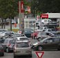 Cars wait to get gas at a petrol station at a supermarket in Saint-Sebastien-sur-Loire near Nantes, France, May 21, 2016 as Total has halted output at some units of three of its refineries in France due to protests over proposed labour law reform that have prompted a blockade of oil depots and petrol stations.   REUTERS/Stephane Mahe ATTENTION EDITORS FRENCH LAW REQUIRES THAT VEHICLE REGISTRATION PLATES ARE MASKED IN PUBLICATIONS WITHIN FRANCE