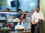 President Barack Obama greets women at the door as he walks from the Bún ch¿ H¿¿ng Liên restaurant after having dinner with American Chef Anthony Bourdain in Hanoi, Vietnam, Monday, May 23, 2016. (AP Photo/Carolyn Kaster)
