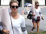 Thousand Oaks, CA - Kaley Cuoco looks ready for yoga class with her cute pink yoga mat and matching slides. Kaley  shows off her toned and tan legs in athletic shorts as she heads inside.\n  \nAKM-GSI       May 23, 2016\nTo License These Photos, Please Contact :\nSteve Ginsburg\n(310) 505-8447\n(323) 423-9397\nsteve@akmgsi.com\nsales@akmgsi.com\nor\nMaria Buda\n(917) 242-1505\nmbuda@akmgsi.com\nginsburgspalyinc@gmail.com