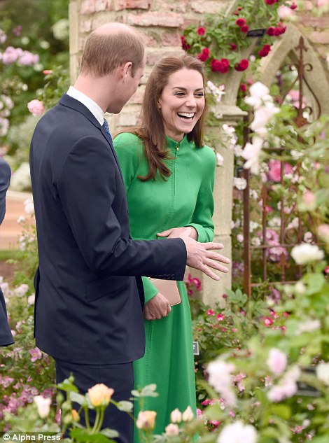 Kate grins by a romantic display