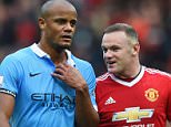 Wayne Rooney of Manchester United and Vincent Kompany of Manchester City talk as they leave the pitch at half time during the Barclays Premier League match between Manchester United and Manchester City at Old Trafford on October 25, 2015 in Manchester, England.  (Photo by Michael Regan/Getty Images)