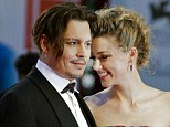 FILE - In this Sept. 5, 2015 file photo, Johnny Depp, left, and Amber Heard arrive at the premiere of the film "The Danish Girl" during the 72nd edition of the Venice Film Festival in Venice, Italy. Court records show Heard filed for divorce in Los Angeles Superior Court on Monday, May 23, 2016, citing irreconcilable differences. The pair were married in February 2015 and have no children together. (AP Photo/Andrew Medichini)
