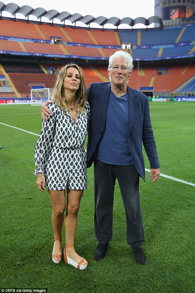 Iconic: Placing his arm affectionately around Alejandra, who dressed in a monochrome playsuit, Gere took in the impressive surroundings of the 81,277 capacity ground