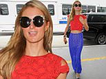 Los Angeles, CA - Paris Hilton wears patriotic colors the day after Memorial day for a flight out of Los Angeles at LAX. The sexy socialite posed for the cameras as she exited her limo and went up the escalator to the security gates.\nAKM-GSI   May 31, 2016\nTo License These Photos, Please Contact :\nMaria Buda\n(917) 242-1505\nmbuda@akmgsi.com\nsales@akmgsi.com\nor \nMark Satter\n(317) 691-9592\nmsatter@akmgsi.com\nsales@akmgsi.com