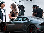 *EXCLUSIVE* West Hollywood, CA - Tyga is seen on set at Last Kings Melrose. The 26-year-old rapper chats up a mystery girl by a Lambo during some down time. Tyga is wearing Puma track pants and a white tee paired with Nike sneakers.\\n\\nAKM-GSI          June 1, 2016\\n\\nTo License These Photos, Please Contact :\\n\\nMaria Buda\\n(917) 242-1505\\nmbuda@akmgsi.com\\nsales@akmgsi.com\\n\\nor \\n\\nMark Satter\\n(317) 691-9592\\nmsatter@akmgsi.com\\nsales@akmgsi.com