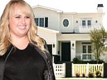 *EXCLUSIVE* West Hollywood, CA - General views of Rebel Wilson's new $3 Million Dollar House. The two-story Traditional, built last year by ROMM Remodeling, has classic curb appeal with a white picket fence, eggshell-colored siding and a decorative oval window above the front door. A covered porch sits off the entrance. Inside, the roughly 4,400-square-foot house features vaulted and coffered ceilings, wide-plank wood floors, delicate wainscoting and a range of white and gray hues. A glass-enclosed wine cellar sits below the stairs.\nAKM-GSI    June 3, 2016\nTo License These Photos, Please Contact :\nMaria Buda\n(917) 242-1505\nmbuda@akmgsi.com\nsales@akmgsi.com\nor \nMark Satter\n(317) 691-9592\nmsatter@akmgsi.com\nsales@akmgsi.com