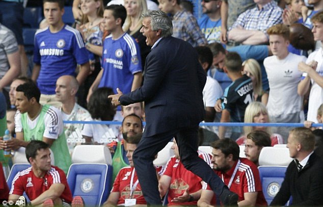 Portuguese boss Mourinho, pictured as the incident happened, claimed Carneiro was 'impulsive and naive' for running on to treat Hazard - but he claims that swear words said on the touchline were not aimed at the doctor
