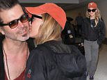 Los Angeles, CA - Renee Zellweger and boyfriend Doyle Bramhall II depart LAX together heading to Atlanta. The two show PDA as they make their way through the terminal. Renee keeps it casual wearing comfy pants and sneakers paired with a The North Face jacket and an orange cap. \n  \nAKM-GSI       June 14, 2016\nTo License These Photos, Please Contact :\nMaria Buda\n(917) 242-1505\nmbuda@akmgsi.com\nsales@akmgsi.com\nMark Satter\n(317) 691-9592\nmsatter@akmgsi.com\nsales@akmgsi.com\nwww.akmgsi.com