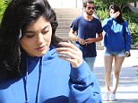 Please contact X17 before any use of these exclusive photos - x17@x17agency.com   Tuesday, June 14, 2016 - Kylie Jenner hides behind Scott Disick as they get sushi together at SUGARFISH wearing matching shades of blue in Calabasas, CA. Kylie supports brother-in-law Kanye West wearing a blue Life of Pablo hoodie paired with extremely short cutoffs and Scott wears a blue t-shirt and blue jeans. AZ-Daddy/X17online.com PREMIUM EXCLUSIVE