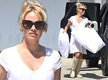 *EXCLUSIVE* Malibu, CA - Pamela Anderson packs her ride with pillows at her storage unit in Malibu. The actress wore a nearly transparent white dress with knee-high beige boots and sunglasses as she loaded multiple large fluffy pillows into her car before returning back to her house.\nAKM-GSI   June  16, 2016\nTo License These Photos, Please Contact :\nMaria Buda\n(917) 242-1505\nmbuda@akmgsi.com\nsales@akmgsi.com\nor \nMark Satter\n(317) 691-9592\nmsatter@akmgsi.com\nsales@akmgsi.com\nwww.akmgsi.com
