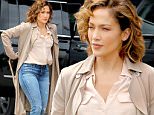 Actress Jennifer Lopez, wearing a trench coat, jeans and Converse sneakers, films 'Shades of Blue' at the Water Ferry Dock in New York City on June 17, 2016\n\nPictured: Jennifer Lopez\nRef: SPL1303941  170616  \nPicture by: Christopher Peterson/Splash News\n\nSplash News and Pictures\nLos Angeles: 310-821-2666\nNew York: 212-619-2666\nLondon: 870-934-2666\nphotodesk@splashnews.com\n