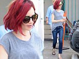 Beverly Hills, CA - Lily Collins keeps it casual while out in Beverly Hills. Lily wore a simple grey top, blue jeans with hem detail, and floral slides.\n  \nAKM-GSI       June 27, 2016\nTo License These Photos, Please Contact :\nMaria Buda\n(917) 242-1505\nmbuda@akmgsi.com\nsales@akmgsi.com\nMark Satter\n(317) 691-9592\nmsatter@akmgsi.com\nsales@akmgsi.com