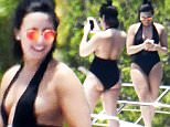 EXCLUSIVE TO INF.\nJune 27, 2016: Singer Demi Lovato wears a black one piece swimsuit as she hangs out on a yacht with friends in Miami, Florida, before the start of her 'Future Now Tour'.\n Mandatory Credit: INFphoto.com Ref: infusmi-20/21