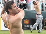 Thom Evans strips off to hit his drive on the 1st hole.\\nCelebrity Cup 2016\\nCeltic Manor Resort\\n10.07.16\\n©Steve Pope Fotowales\n\nCeltic Manor