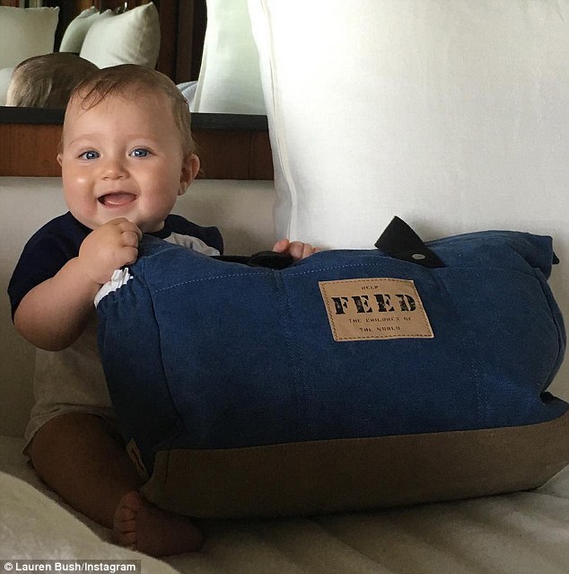 All smiles! Lauren Bush Lauren took to Instagram on Wednesday to share this precious photo of her nearly three-month-old son James holding one of her charitable company's FEED bags 