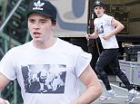 EXCLUSIVE:  Brooklyn Beckham works up a sweat as he jogs in natty running gear in NYC.\nThe 17-year-old wore shorts over camouflaged leggings as he worked out in Greenwich on Tuesday afernoon. \nHe also chatted to heavily tattooed male friend and a pretty girl.\nThe eldest son of former England football captain David Beckham and fashion designer wife, Victoria, has signed up to a photography course at The New School, an arts and design college.\nBrooklyn has already been used for shoots by fashion house Burberry.\nLife is looking good for Brooklyn, who dates actress Chloe Grace Moritz, 19, and learned to drive in a  Pounds 37,000 Mercedes C-Class.\nHe also has 7.6 million followers on photo-sharing website Instagram.\n**PLEASE AGREE FEE BEFORE USAGE**\nPlease contact David Ellis 07967967211 david.ellis3@icloud.com
