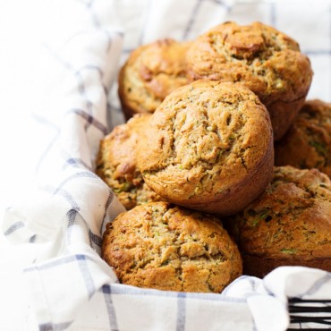 Honey and Olive Oil Zucchini Muffins - hard to believe these sweet, moist, jumbo puffy muffins are healthier with whole wheat, olive oil, and no refined sugar! 280 calories. | pinchofyum.com