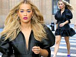 New York, NY - Rita Ora struts her stuff while filming for "America's Next Top Model" as she is seen looking fierce with blue eyeliner, a ruffled black dress, blue heels, and blown out blonde hair.\nAKM-GSI          July 24, 2016\nTo License These Photos, Please Contact :\nMaria Buda\n(917) 242-1505\nmbuda@akmgsi.com\nsales@akmgsi.com\nor \nMark Satter\n(317) 691-9592\nmsatter@akmgsi.com\nsales@akmgsi.com
