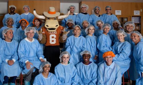Group of pharmacy students with Hook 'Em mascot.