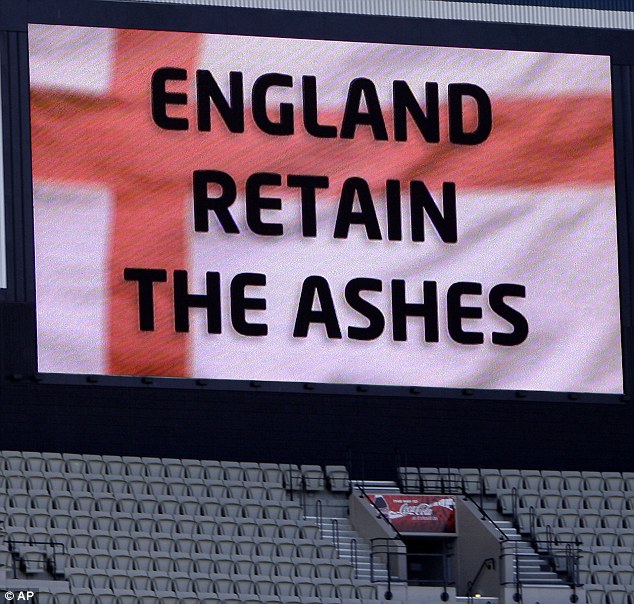 Up in lights: The MCG video screen delivers the bad news to the Aussie supporters