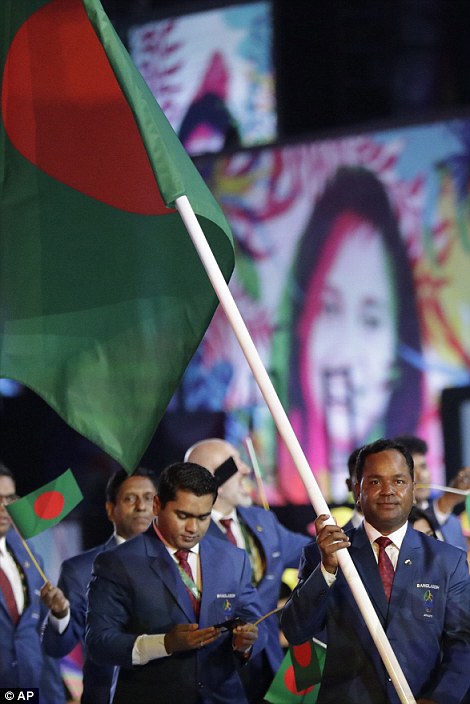 Mohammad Rahman carries the flag of Bangladesh during the opening ceremony for the 2016 Summer Olympics in Rio de Janeiro, Brazil 
